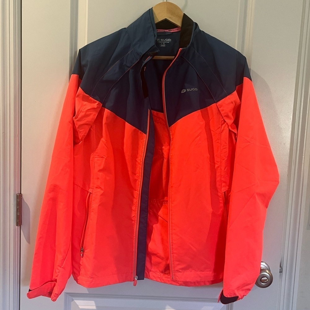 SUGOI Navy and Neon Pink Cycling Jacket-versa full zip 2/1 magnetic